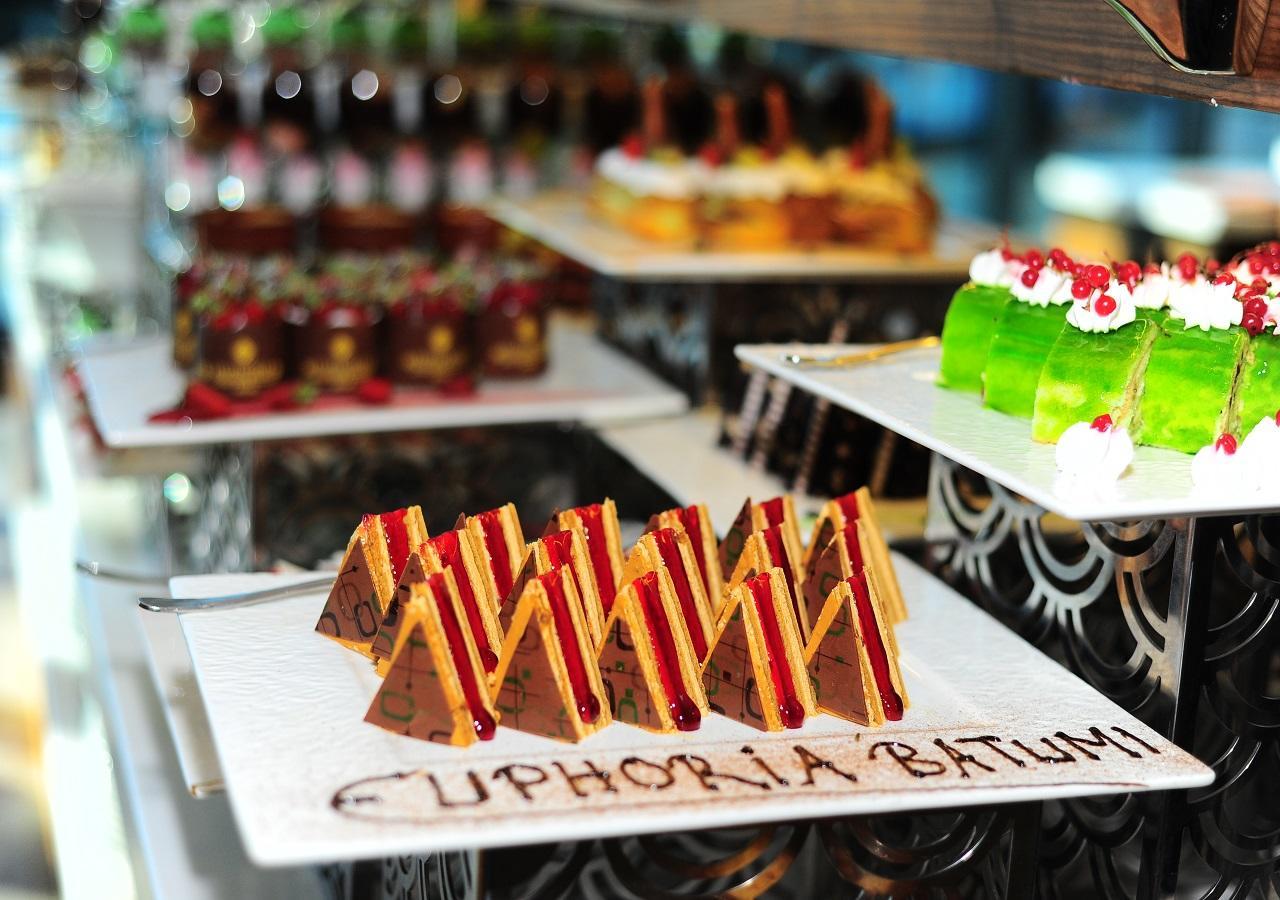 Euphoria Batumi Convention & Casino Hotel Kültér fotó A selection of cakes