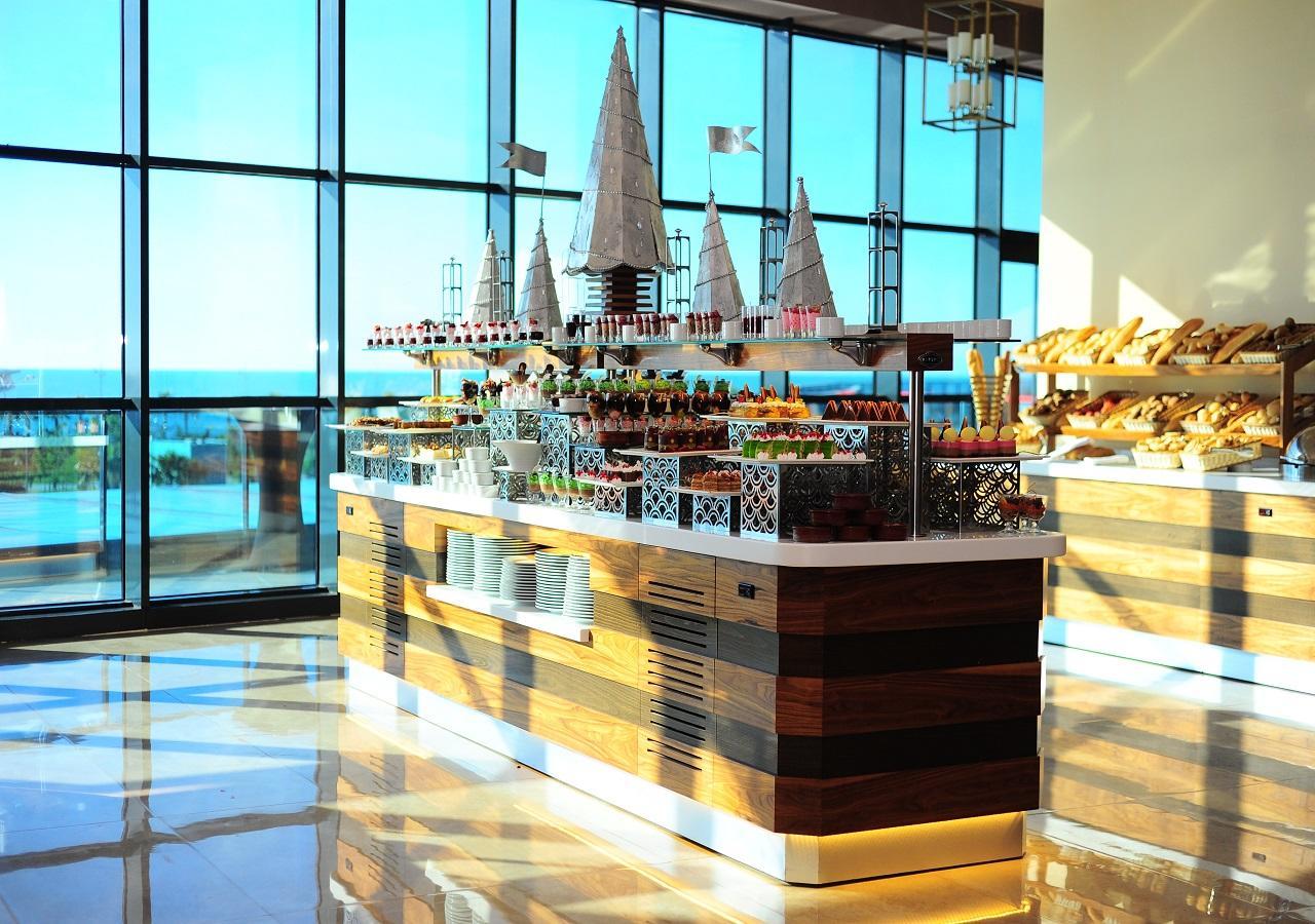 Euphoria Batumi Convention & Casino Hotel Kültér fotó The buffet at the 360° restaurant