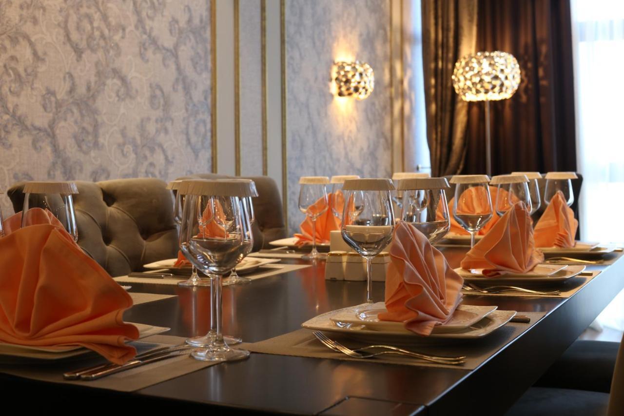 Euphoria Batumi Convention & Casino Hotel Kültér fotó A table set for a meal